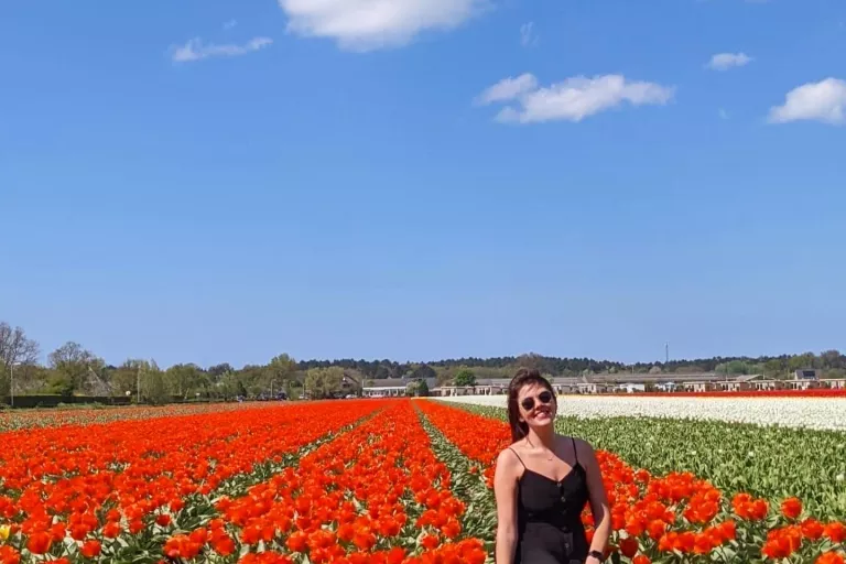 dani in red flower field